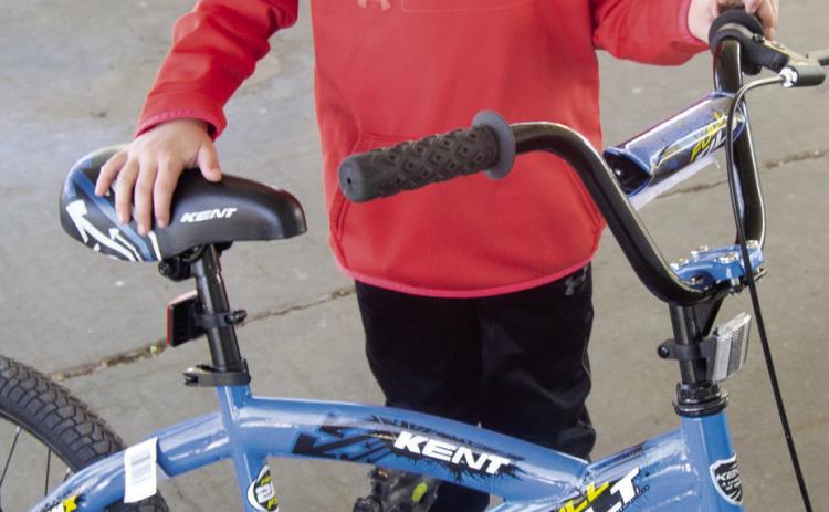 Jaxson Harper, 9, of Columbus found the lucky egg that gave him a new bicycle for Easter. A large turnout of the various age groups filled the City Park with.