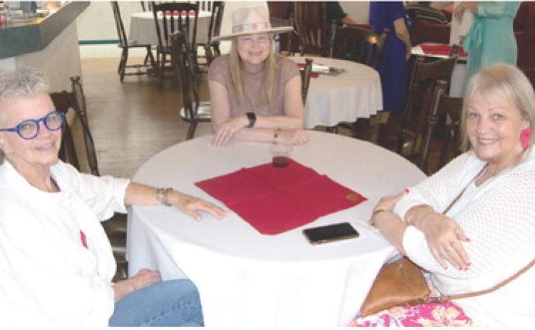Three members of the Joplin Regional Art Coalition discuss the art show at Maple UnCommon Guesthouse and Gallery on Maple Street in Columbus. Joplin (Mo.) Globe columnist Marta Churchwell, Kim Kessel and Linda Peters are regulars at the JRAC exhibits.