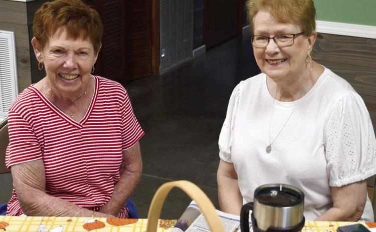 Always willing to lend a helping hand at local fundraisers, Myrna Martin and Lorna Stover were among those helping out the event for Jim Bowles and Sandy Louthan.