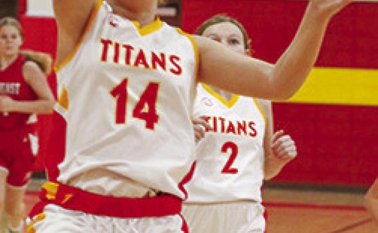 Columbus Lady Titan, Annabell Baker, drives in for a layup in the Saturday, Jamboree, hosted at the Columbus Unified High School Gym. Laklynn Carter trails for the rebound.