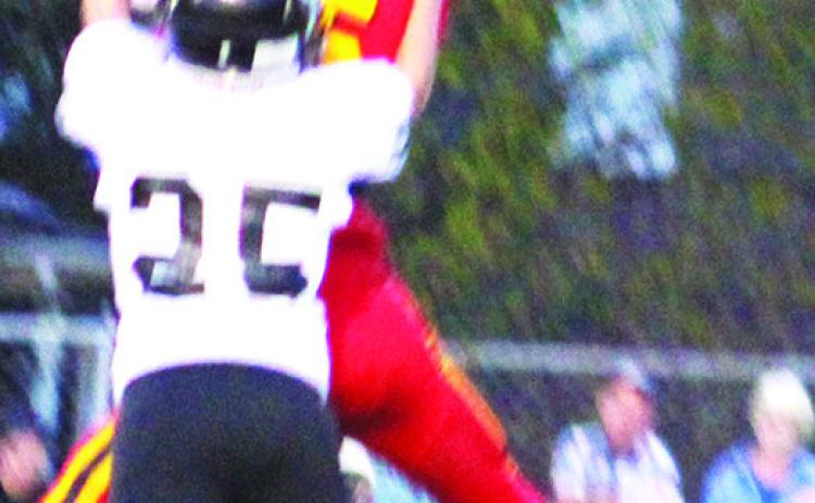 Titan Freshman, Kooper Saiz, comes down with a catch against the Frontenac Junior Varsity, Monday, at Titan Stadium. The Raiders took the win, 20-0.