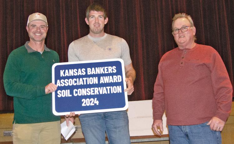 Kansas Bankers Association Key Banker Jim Gaither presented the Cherokee County Kansas Bankers Conservation Award to Crey Brake for his conservation efforts on his farm south of McCune. The award was presented during the County Conservation Dinner on Monday evening.