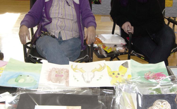 Framed and unframed artwork by Karen Hardessey aand Tabatha Sublertte were among the popular and creative items at the Pecan Festival as it returns to Chetopa