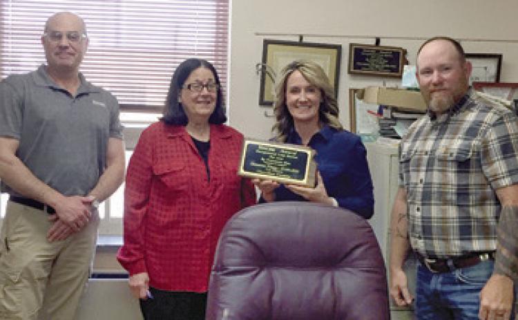 Cherokee County Commissioners Myra Carlisle Frazier, Lorie Johnson and Cory Moates accepted a first place award for exceptional loss ratio’s from KWORC loss prevention specialist and marketing director Jes Pfannenstiel at an April meeting.