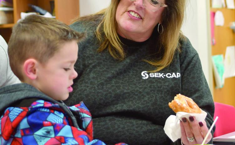 Maddox Grant enjoyed a visit with Jamie Ball at Park Elementary recently for their Books and Breakfast event. Friends, family members and older students read a book or two and had breakfast at the event. Courtesy photo.