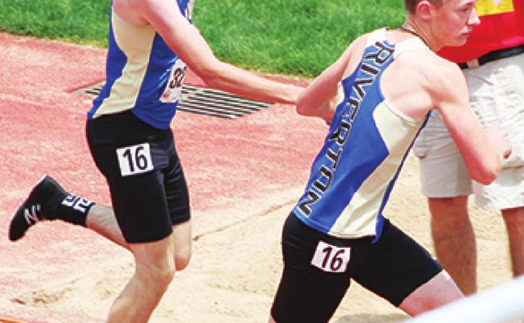 Members of the 4x800 Meter Relay Team, above: Jaxon Gantt to Dillon Leggett and below: Tyler Haywood to Michael Sheperd, exchange the baton at the KSHSAA State Class 3A Track and Field Meet, Friday in Wichita. The Ram Team placed 16th with a time of 9:11.4 minutes. Photos by Dee Riley.