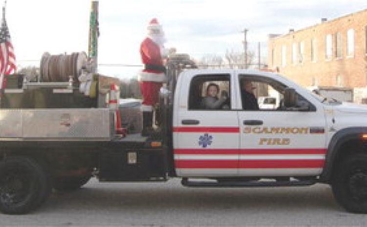 Santa made an early appearance in Scammon Sunday. He was escorted through the parade on one of the city’s fire trucks.