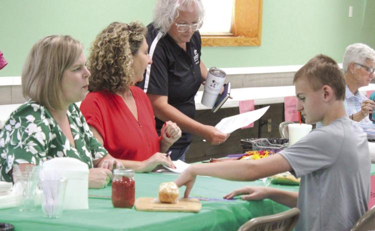 Judges help entrants develop project, communication skills