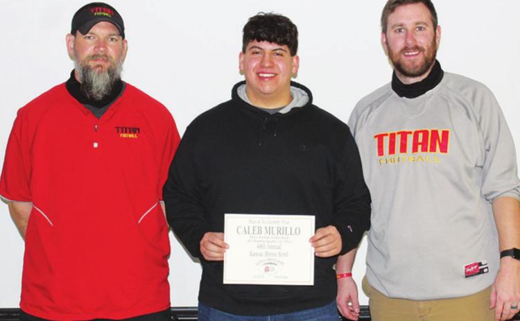 Caleb Murillo, Titan Senior Offensive Lineman,received his official invitation to play in the 2021 Kansas Shrine Bowl Football Game during recent ceremonies at the Columbus High School Gymnasium. Titan Football Head Coach, Blake Burns and assistant coach, Matt Crain were on hand for the presentation.