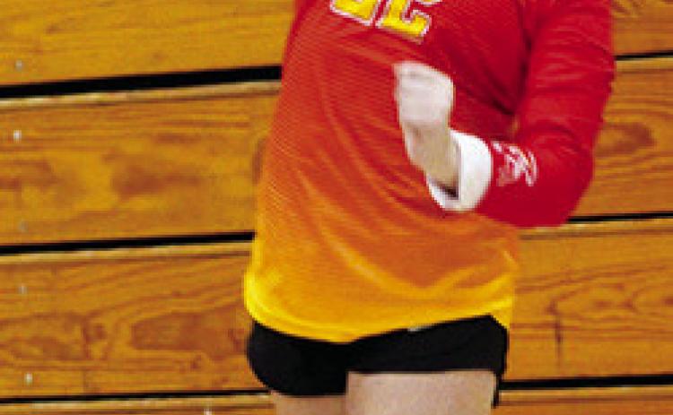 Lady Titan Eighth Grader, Landrey Perry, serves for Columbus in recent matches at the CUHS Gymnasium. The Lady Titans ended their season yesterday in the CCCJL Tournament in Frontenac.