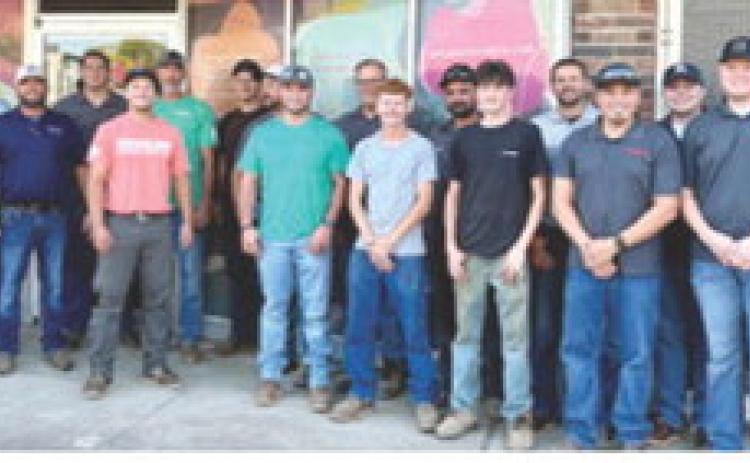Thursday morning, 20 employees of Crossland Heavy unloaded and stacked 125 new twin mattresses for Dream Big Little One. Courtesy photo.