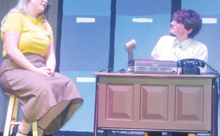 The musical comedy “Pajama Game” will be performed at CUHS over the weekend. Students Hannah Daniels as “Babe” Williams and John Smith as Sid Sorokin perform a scene together near the end of the first act. Photo by Jacob Spencer.