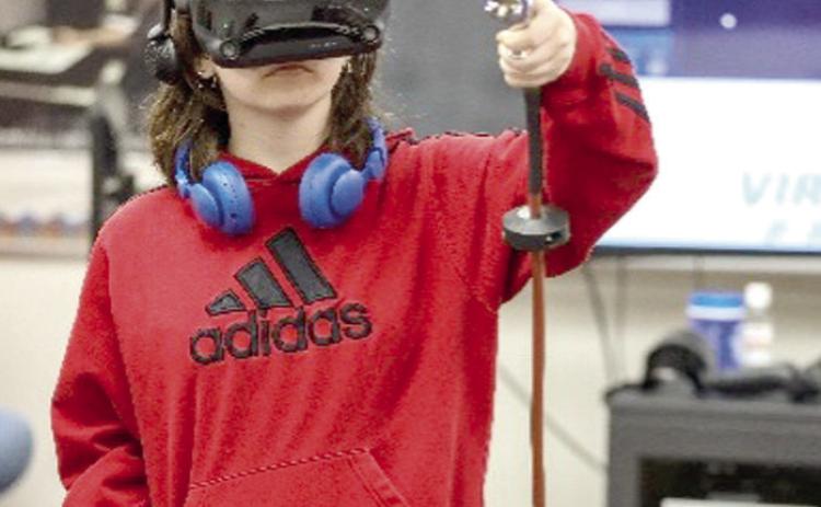 An area high school student testing out the new Virtual-Paint VR training system during Tech Days this past semester. Courtesy photo.