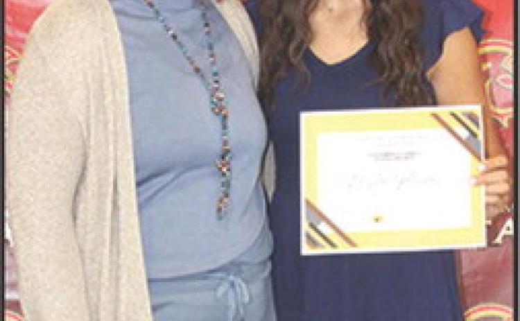 Brylie Johnson received the Columbus Cares Columbus Community Foundation Scholarship in the amount of $500 at the Senior Assembly, May 16, in the Columbus Unified High School Gymnasium. The presentation was made by Kelly Walters, USD 493 Title 1 Reading Specialist.