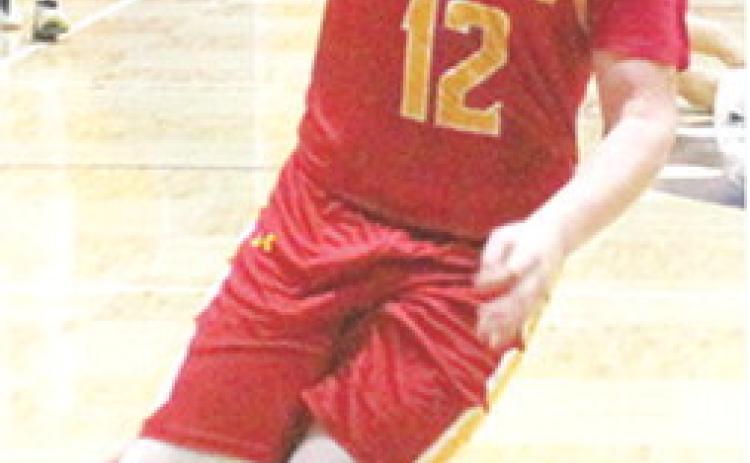 Titan Junior, Ethan Midgett, gets a steal late in the fourth quarter and drives to the basket to help seal the road win for Columbus in Galena, 48-36, Friday.