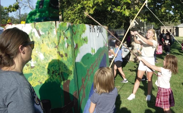 A popular game at the USD 493 Back to School Carnival was the fishing pond. Youngsters lined up for a chance to cast their line to win some fun prizes.