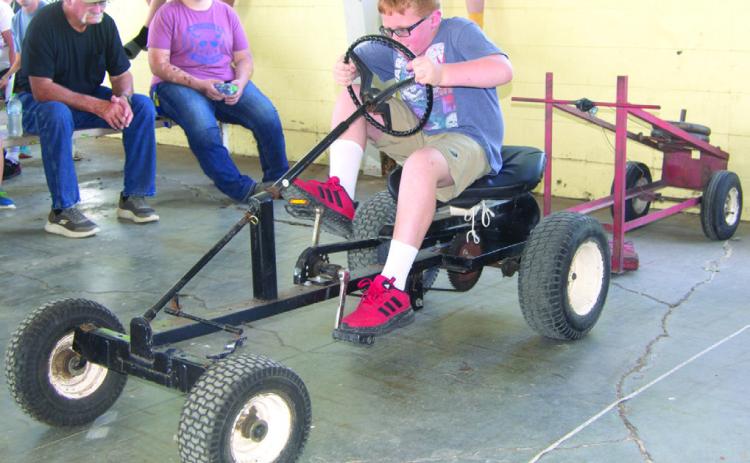 During the annual Pedal Tractor Pull, younger children get to try their hand at a smaller tractor, while older youngsters try their hand at this one. Winners in each division have the opportunity to compete at the Kansas State Fair.