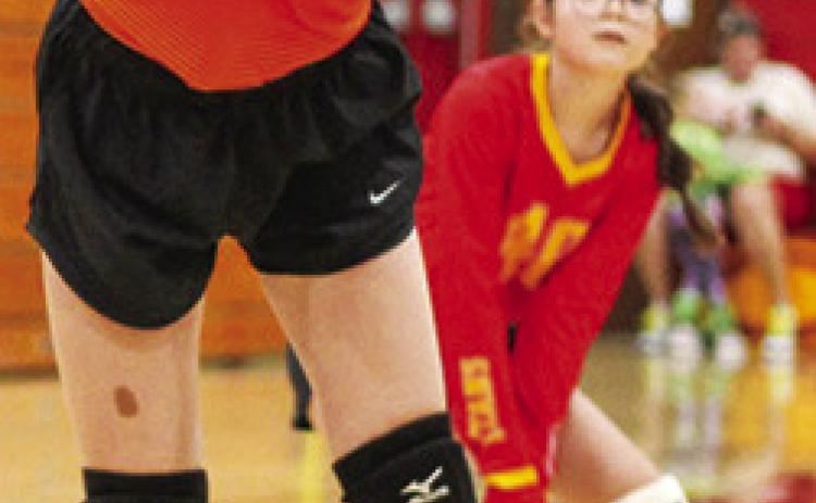Seventh Grader, Kensley Blackledge, returns a hit during recent Columbus matches at the CUHS Gymnasium. Awaiting the result is Madison Duling in the background.