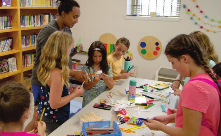 Many crafts start with wooden popsicle sticks including the projects at the Columbus Library Summer Reading Program. Recently about 50 youngsters attended. The students include Everlee Roberts, Wren Ellis, Olivia Dainty, Ruby Ellis, Ally Walters and Mollie Coleman.