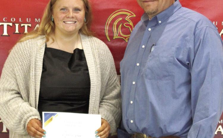 Madisen Rand received the MFA and National FFA, Scholarships for $5,000 from Columbus High School FFA Advisor, KC Youngblood, during the 2025 Senior Assembly, May 16, at the CUHS Gymnasium.