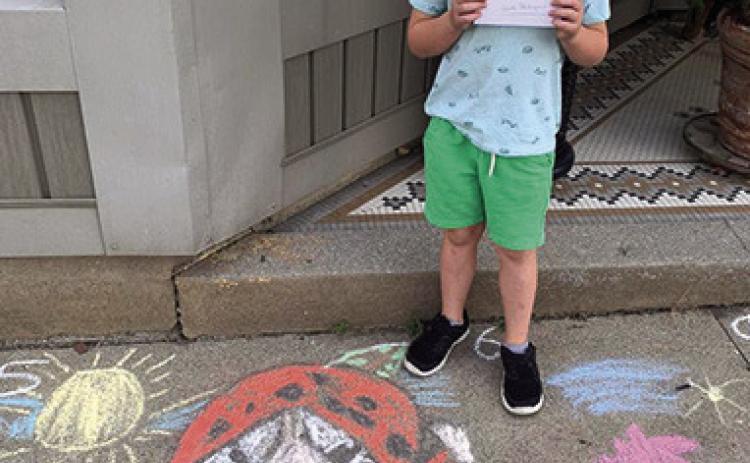 Winner of the first sidewalk chalk contest held during the Columbus Day Festival was Kai Vernon. The contest gave artists an opportunity to show their creativity to the community.
