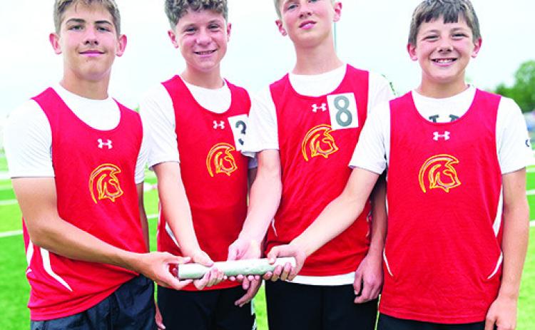 The Columbus Titan Seventh Grade 4x800 Meter Relay Team set a new school record at the Girard Invitational Track and Field Meet, April 17. Team members Blaze Bowman, Evan Walters, Eli Engleman, Cam Carter completed the race with a time of 11:13.7 minutes beating the 2002 record of 11:38 minutes set by Chet Mercer, Cory Burton, Chris Wells, and Cody Morris. Courtesy photo.