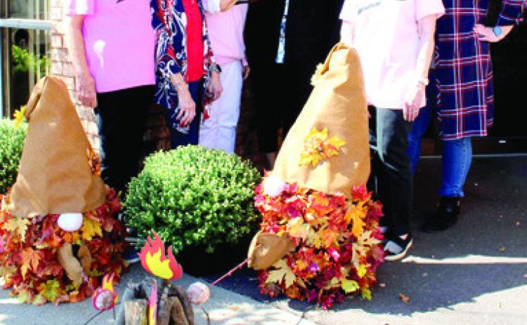 American Bank was the second place winner in the PEO fall decorating contest. Delores Crane, Judy Hill, DeAnn Binns, Sarah Lynn Thompson, Sarah Thompson, Hailey Carver and Kathryn Aupperle were on hand when the prize was presented. Courtesy photo.