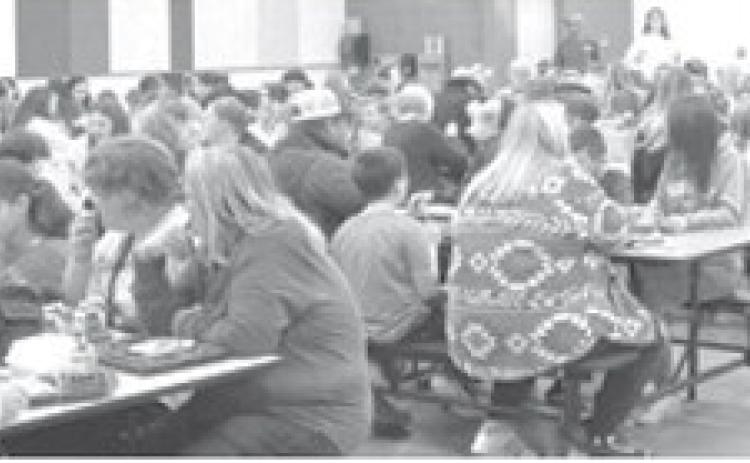 Guests join fifth graders for Thanksgiving lunch