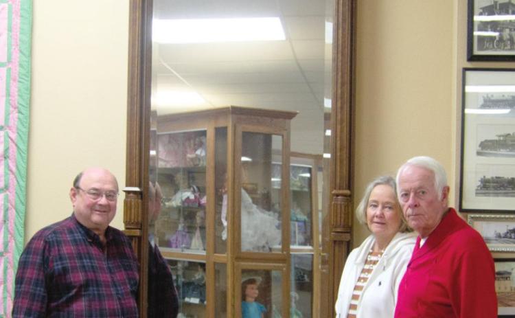 Wes and Jan Houser donated an 11-foot tall, 182 year old mirror to the Columbus Museum last week. Ron Holmes was present to formally accept the donation March 11. Photo by Jacob Spencer.