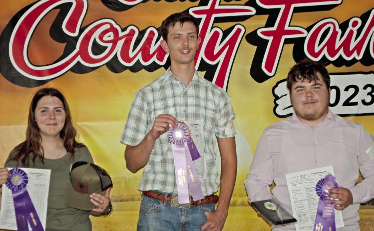 The 4-H dog show was held Tuesday of Fair Week. Airauna Sharp received Grand Champion in intermediate showmanship. Michael Shepard was Reserve Champion in Senior Showmanship and Charles Sharp was Grand Champion in Senior Showmanship. Photo by Destynne Goff.