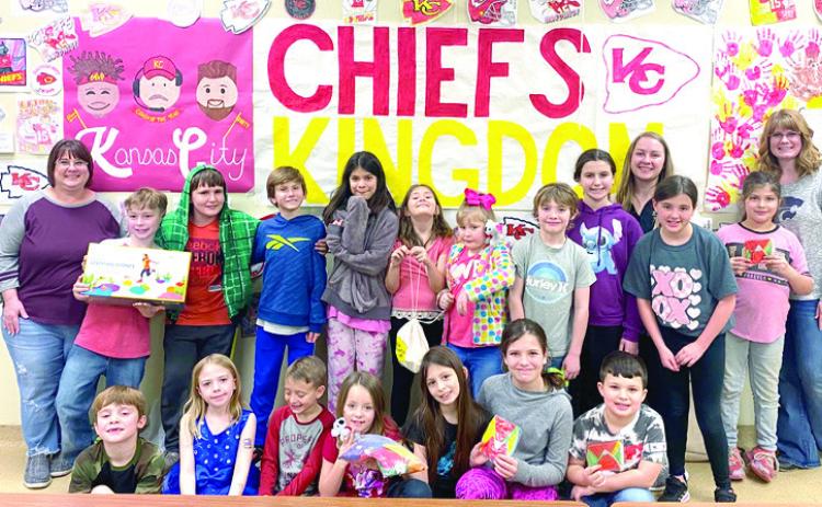 The Columbus Highland afterschool program with Kandice Ediger, Julie Thomas, and Kate Fluckiger from Cherokee County K-State Research and Extension. The program received a physical activity bundle after completing a six week nutrition and physical activity class. Courtesy photo.