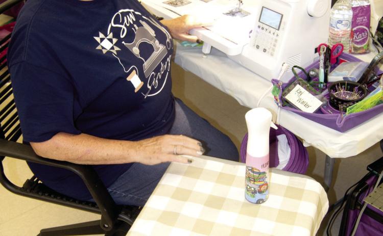 Kay Walker, Parsons, has her quilting area set up for two days of uninterrupted quilting, except for brief visiting breaks, meals and snacks. The quilters are sort of in a group of their own as the others are also.