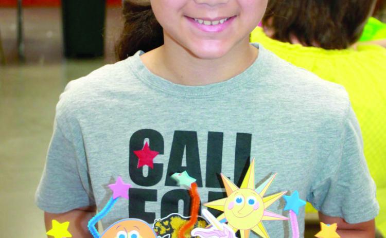 Glittering Stones 4-H Club member Kayelynn Adoremos earned three purple ribbons and a blue ribbon in the Visual Arts and Crafts classes during the cherokee County Fair.