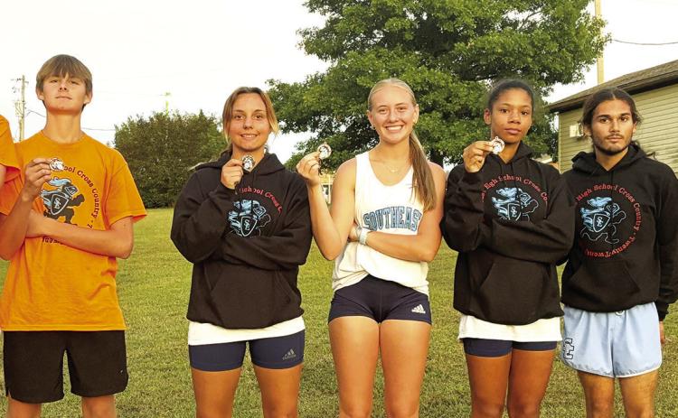 Zayne Gabern, Tucker Sutton, Jackie Robinson, Kendyl Renn, Journee Rimmer, Zack Whittenburg, and Michael Smith were the individual medalists for the Southeast Lancers in their home cross country meet, Thursday, at the Weir Baptist Church Camp. The Lancer Varsity Boys Team placed second in the team standings. See complete results on page nine of today’s News-Report. Courtesy photo.