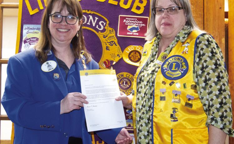 Lions District Governor Lori Horton presented Columbus Lion Janet Lindsey with her 20 year pin as a member of Lions International. The presentation was made during the Columbus Lions Club meeting Monday night. Janet said she became a Lion when the Kiwanis Club closed and four members joined the Lions. Gov. Horton said she was impressed by the local clubs activities.