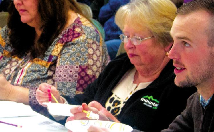 Around 20 local youths participated in the 4H Day competition on February 19. Judge Tyler Zustiak, Clerk Carl Karsten and 4H Agent Valori Stone served on the officiating panel at the Columbus site during the event. Photo by Jacob Spencer