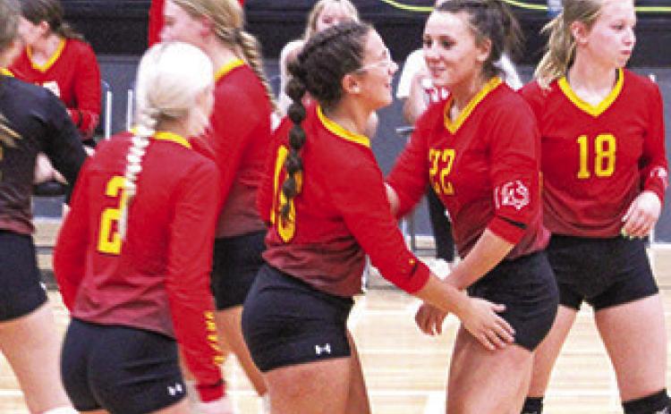 Katy Mooney and Katie Simpson celebrate after a point at the Frontenac Tournament recently.