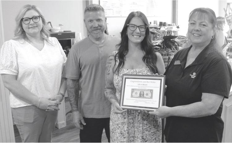 The “First Dollar” plaque was presented to Jennifer Reid, florist and Nate and Casey Long, owners of Life in Bloom and Co. by Sonja Duley at the recent ribbon cutting and open house held Friday. Life in Bloom and Co. sells fresh cut flowers, live plants and gift items. They also feature a coffee bar offering a variety of specialty drinks.