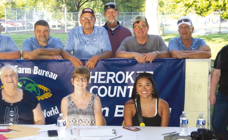 It takes a large crew of Farm Bureau members to keep the peddle pull contest operating this year the volunteers included (front) Michelle Hilderbrand, Debbie Evans, Anna Coberley and Holly Johnson. (Back row) Jeff Clark, Jason Allison, Jack Getman, Craig Stover, Jay Evans and Chris Westervelt.