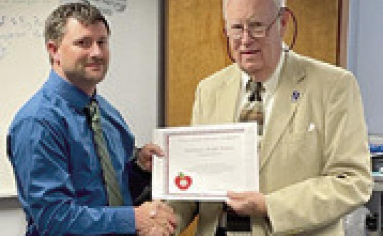 A Challenge Award was presented to Southeast Middle School Principal Nick Hansen by Kansas State Board of Education member Jim Porter. Courtesy photo.