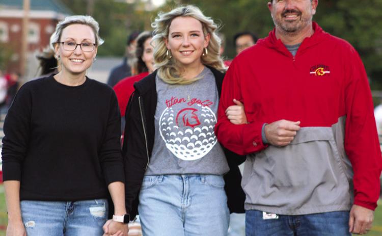 Lady Titan Senior, Reese Grundy, was recognized on Senior Night at Titan Stadium, October 13. Reese is a four-year member of the Lady Titan Golf Team. She was escorted by her parents, Lindsay and Daniel Grundy.