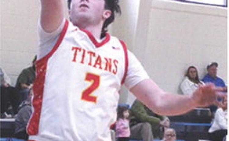 Titan Senior, Jett Tanner, scored on back-to-back steals and layups in the Columbus, Lancer Classic, loss to Commerce, Okla., 50-65, Saturday, at Southeast High School. Jett led the team in scoring with 14 points.