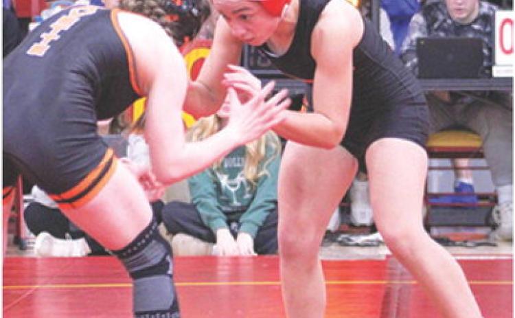 Lady Titan Hannah Noel, takes on an opponent during the recent Columbus Duals Tournament at the CUHS Gym. Hannah opened the season with a third place finish at the Kan-Okla Tourney and a win in the Bentonville West Tourney.