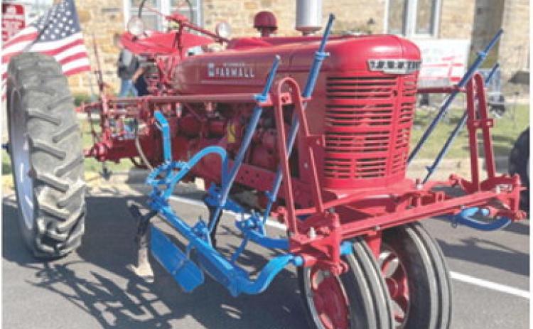 The Farm Heritage Show was held during the Columbus Day Festival. The above tractor, a 1951 Farmall H was entered into the show by Jim Zook. He was awarded “Best in Show”. Zook is pictured below right.