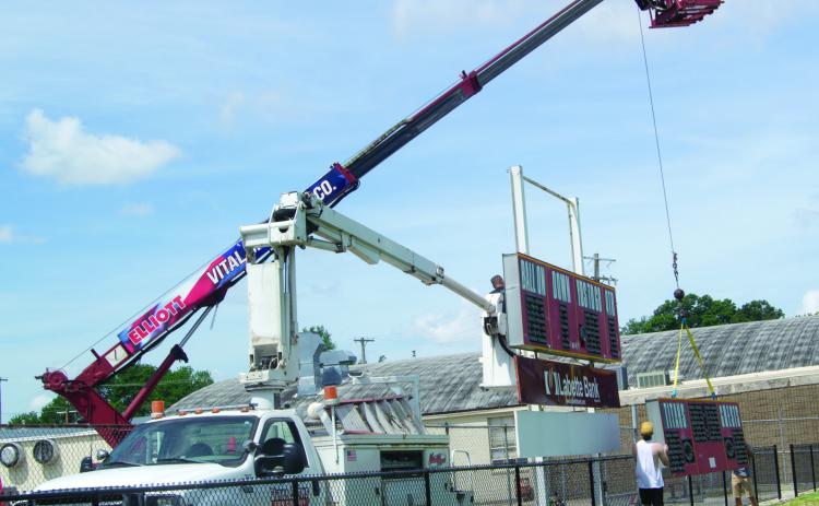 After more than 30 years, the Columbus High School football scoreboard has been removed from the south end of the stadium. If the scoreboard could talk, the stories it could tell. It will be replaced this summer and next year the Titans will be playing before a new modern scoreboard. Vital Signs is handling the sign replacement.