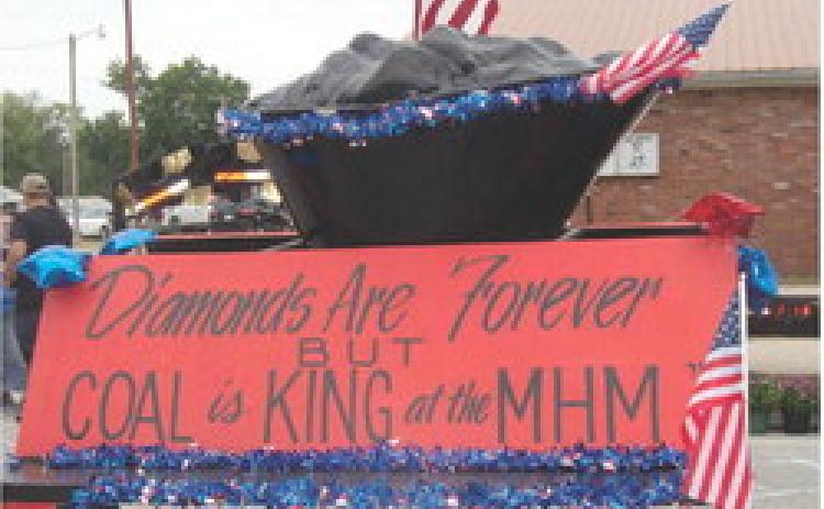 Miners Hall Museum float that appeared in the Weir Homecoming parade. The parade’s theme was “When Coal Was King”. Tilton and Sons’ House moving pulled the museum float. They are the company moving the “one-of-a-kind” Page 618 Dragline to Franklin. The Page 618 Dragline will be the “only” and “largest” walking dragline preserved in the United States.