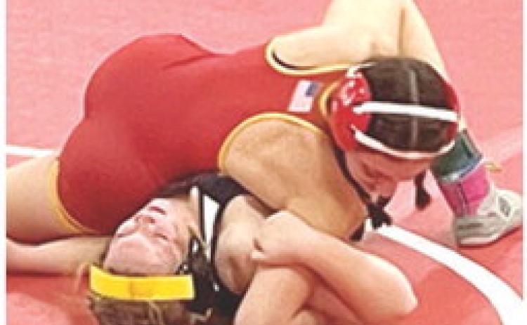 Sophomore wrestler, Montana Ortberg, won by fall over, Josslyn Miller, Fredonia, at the Lady Titan Wrestling opener, Friday. Montana scored seven team points for Columbus in the Kan/Okla Tournament at Caney Valley High School. Courtesy Photo.
