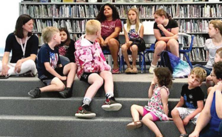 Those attending the Johnston Public Library Tails and Tales program