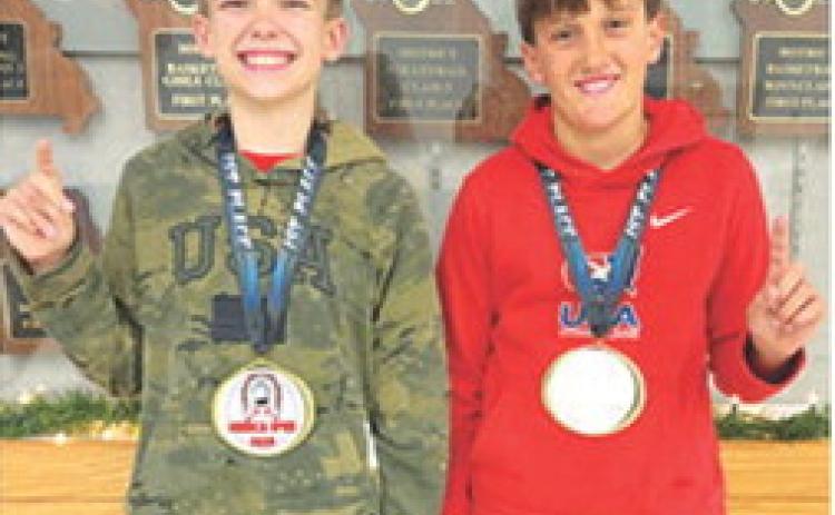 Lucas Natalini, 12U, 95B, and Briggs Johnson, 12U, 100B, took first place in their respective age/weight classes at the Seneca, Mo. Youth Open Tournament, December 7. Lucas got two quick falls before winning a 5-3 decision in the championship match. Briggs won his first match by fall then earned technical falls in the semi-final and championship matches. Courtesy photo.