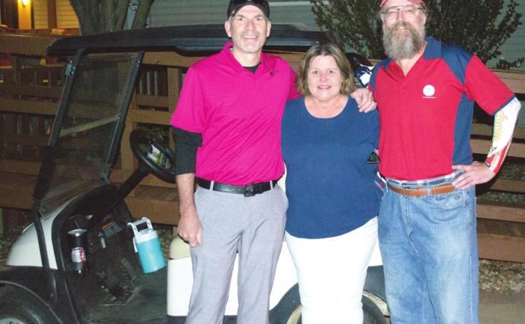 Two Arkansas men played 18 holes of golf on four courses in four states on Tuesday. Ty Stephenson, Bella Vista and Shane Working of Cave Springs started the trip in Baxter Springs on Tuesday. The two men posed with Golf Club hostess Jackie Gaffingaux before the first tee.